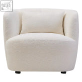 Cream curved chair with plush textured cream fabric and matching cushion perfect for cozy seating