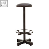 Black metal bar stool with cushioned antique blue leather seat and footrest for comfortable seating