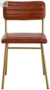 Buffalo tan leather dining chair with tufted backrest and gold finish metal legs for stylish dining rooms