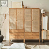 Light wood framed caden rattan wardrobe with woven cane panels and three drawers on each side