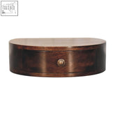 Dark brown oval california walnut wall mounted bedside table with single drawer and brass knob