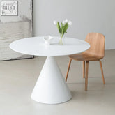 White calvin cone round dining table with a conical base perfect for modern dining spaces