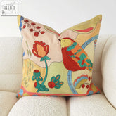 A vibrant camila idyllic cushion with colorful bird embroidery on soft fabric material 45 x 45cm