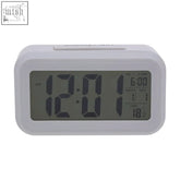 White camran grey lcd digital clock with jumbo number display showing time date and temperature on a rectangular screen