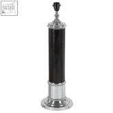 Canon black leather table lamp with black cylindrical shade chrome accents and decorative finial detail