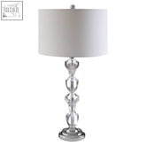 Carine glass table lamp with clear glass body white cylindrical shade and chrome base perfect as a glass table lamp