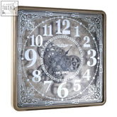 Carlin antique gold square wall clock with ornate silver-toned frame and vintage face featuring gearwork design