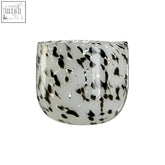 A sleek translucent white glass speckled grey planter with modern curved design called carra speckled gray planter