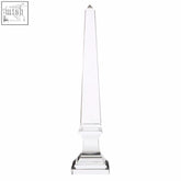 Clear large crystal obelisk with a pointed top and tiered base perfect for decoration or display