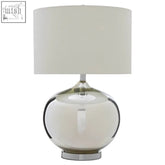 A sleek carson glass table lamp with a frosted glass base and white cylindrical shade ideal for modern decor