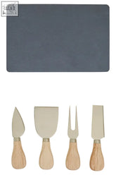 Gray slate board with four wooden-handled metal utensils in gold finish cheese knife set for serving cheese