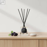 Clear glass cassis diffuser 100ml with black reeds and parks aromatherapy label featuring premium fragrance oils