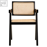 Black-framed cebu natural cane dining chair with woven natural cane back and seat in black beech wood