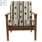 Cefena armchair with angular arms features a wooden frame and cream black brown striped upholstery with white weave accents