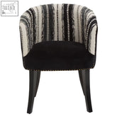 Cefena black and white chair with black velvet armrest, white striped fabric, and mango wood legs adds depth to any space
