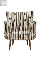 A mid-century modern cefena black white chair with flared arms upholstered in cream black and brown ikat fabric with wooden legs