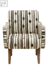 A cefena black and white chair with straight arms upholstered in cream fabric with bold stripes and wooden legs
