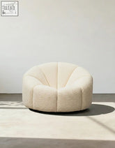 Cream-colored plush shell-shaped pumpkin round armchair in soft white boucle fabric for cozy seating