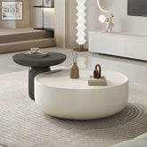 White oval cenhelm nesting coffee table with smooth glossy finish and minimalist cream and black design