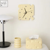 Cream-colored cheese style clock with square shape and perforated design perfect for kitchen decor
