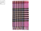 A chesil check wool throw in raspberry featuring a soft woolen plaid pattern with pink purple black and cream fringe