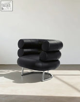 Black leather armchair chester vintage leather with cylindrical cushioning and sleek chrome base vintage leather armchair