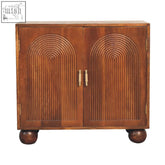 Brown wooden chestnut carved ball chest of drawers with arched ribbed paneling and brass handles for storage