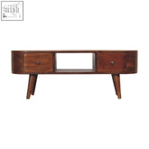 A sleek dark brown mango wood coffee table with two drawers and tapered legs in chestnut finish with open slot design