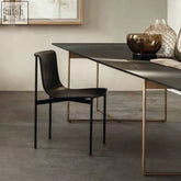 Black leather choi dining chair with armrest and sleek metal frame perfect for stylish dining spaces