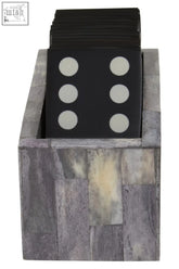 Black dominoes coasters with white pips stacked in a grey bone stone holder from churchill games domino set