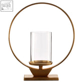 Cirqua medium gold finish candle holder with a gold finish circular base and clear glass cylinder for candles