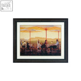 City framed winery terrace wall art with black frame showing sunlit outdoor café scene and yellow umbrellas