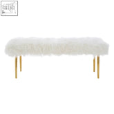 Clarence white fur effect bench with slender gold legs featuring soft faux fur and modern design