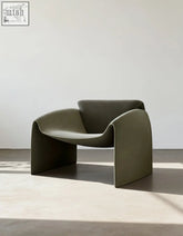 Olive green classic crab armchair with real leather upholstery and a sleek minimalist sculpted form