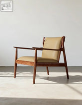 Mid-century modern hans w ch65 claude easy armchair with tan leather upholstery and solid wood dark frame
