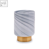 Cleo small grey vase featuring a sleek cylindrical grey glass body with marble pattern on a polished brass base
