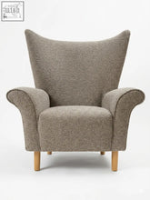 Cozy taupe coco wing chair with textured fabric and curved solid beech wooden legs for stylish comfort