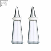 Two clear glass cream plastic icing tips with stainless steel nozzles and white ceramic rings for vinegar set use