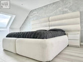 Cream-colored upholstered bed with tufted contempo headboard and matching platform base for stylish comfort