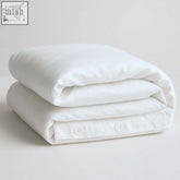 White cotton duvet cover with button closure and minimalist design for cool and comfy eucalyptus duvet use