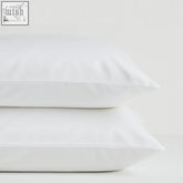 Two crisp white cool and comfy silk oxford pillowcases made from eucalyptus fibre naturally hypoallergenic