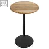 Corra side table with round wooden top and matte black metal frame pedestal base for stylish living spaces