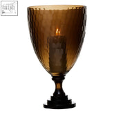 Amber-colored hammered glass candle holder with dark wooden base cortina medium honeycomb glass candle holder