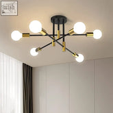 Modern black and gold criss cross ceiling light with six spherical bulbs and geometric metal design for stylish lighting