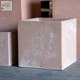 A blushstone extra large square concrete planter in light pink with a matte textured stone-like finish perfect for plants