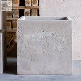 Gray concrete large square planter with textured speckled surface and sharp edges cubrosa truffle 55cm 115l pot
