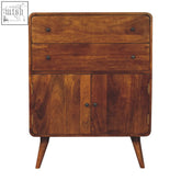 A warm medium-brown curved nordic charm chest of drawers with dark knobs made of solid mango wood