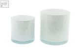 Two frosted glass candle holders with blue tint and speckles from dutz collection mouth blown glass series