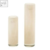 Two translucent cream beige mouth blown glass vases from dutz collection with etched dutz logo near the top