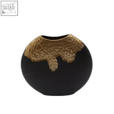 Small black and gold round vase made of ceramic with textured gold metallic accent around the rim